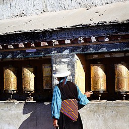 Woman and Prayer Wheels, Shigatse